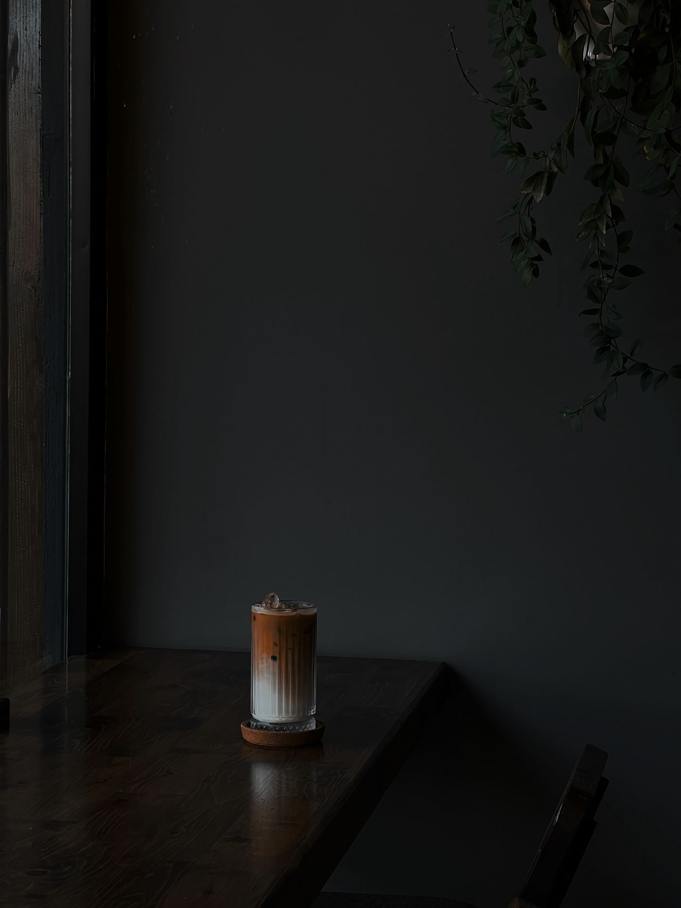 A dark table with coffee
